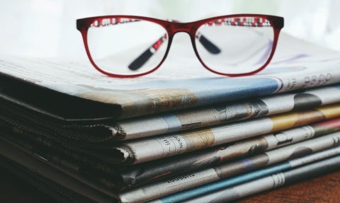 Glasses on newspaper.